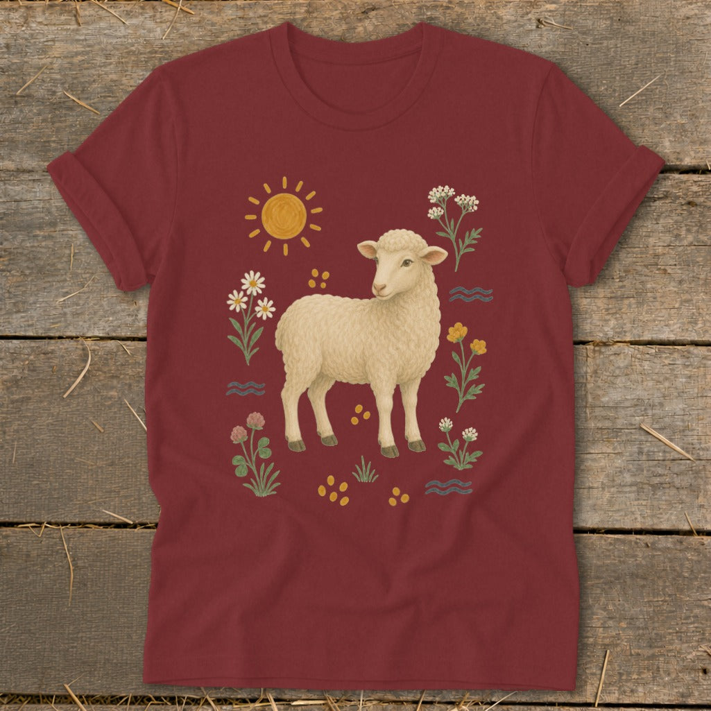 Maroon t-shirt with a cream sheep surrounded by a sun, flowers, and wavy lines.
