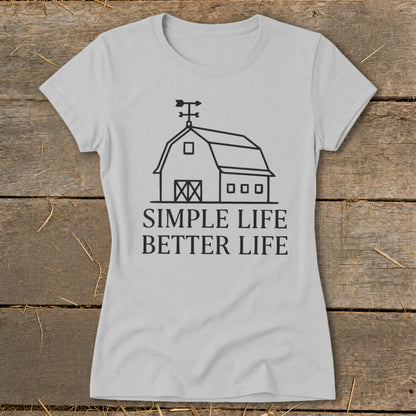 Light grey t-shirt with a line drawing of a barn and the text "SIMPLE LIFE BETTER LIFE".