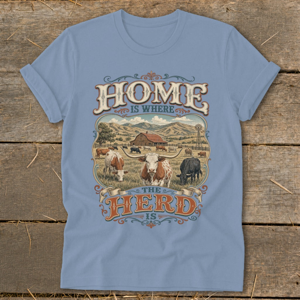 Light blue t-shirt with "HOME IS WHERE THE HERD IS" phrase and farm scene.