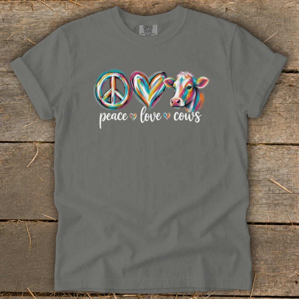 Gray t-shirt with colorful peace sign, heart, and cow graphic and "peace love cows" text.