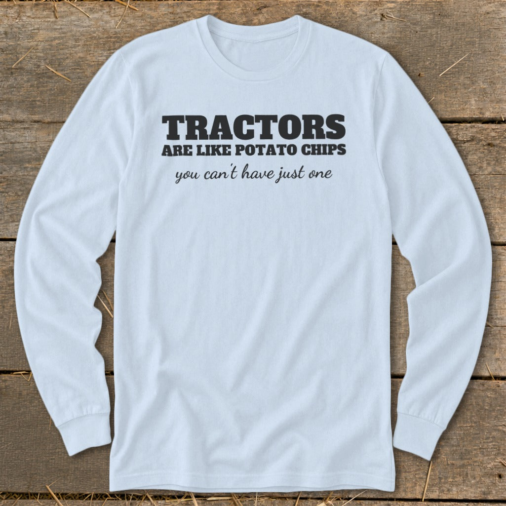 Light blue long-sleeve shirt with black text: "Tractors are like potato chips you can't have just one".