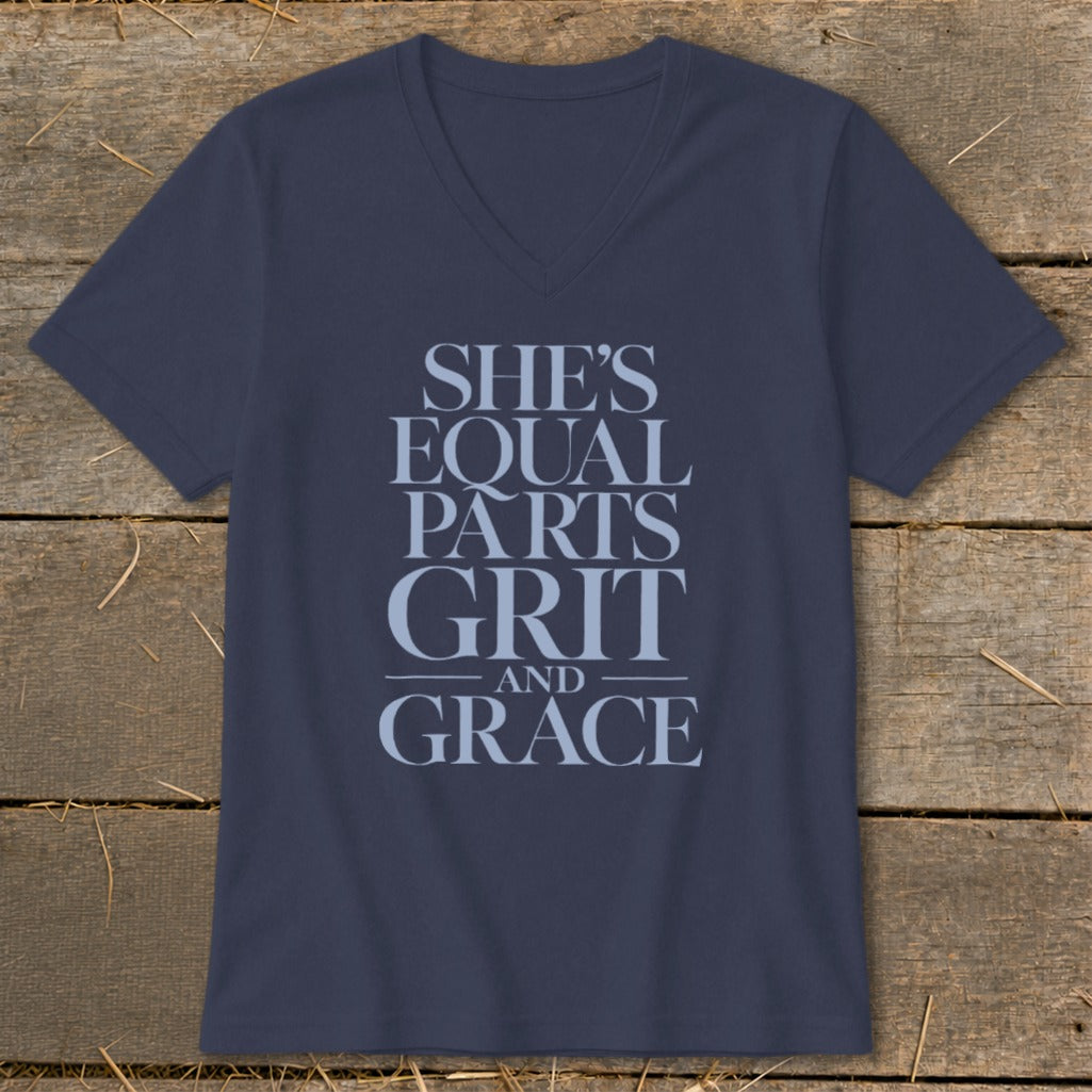 Navy v-neck t-shirt with text "SHE'S EQUAL PARTS GRIT AND GRACE".