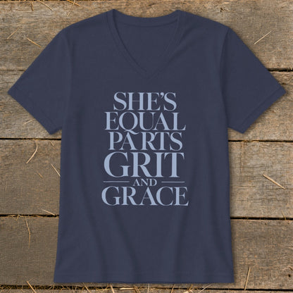 Navy v-neck t-shirt with text "SHE'S EQUAL PARTS GRIT AND GRACE".