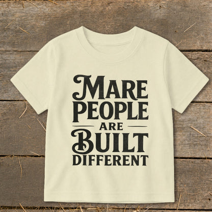 Light yellow t-shirt with black text: "Mare People Are Built Different"