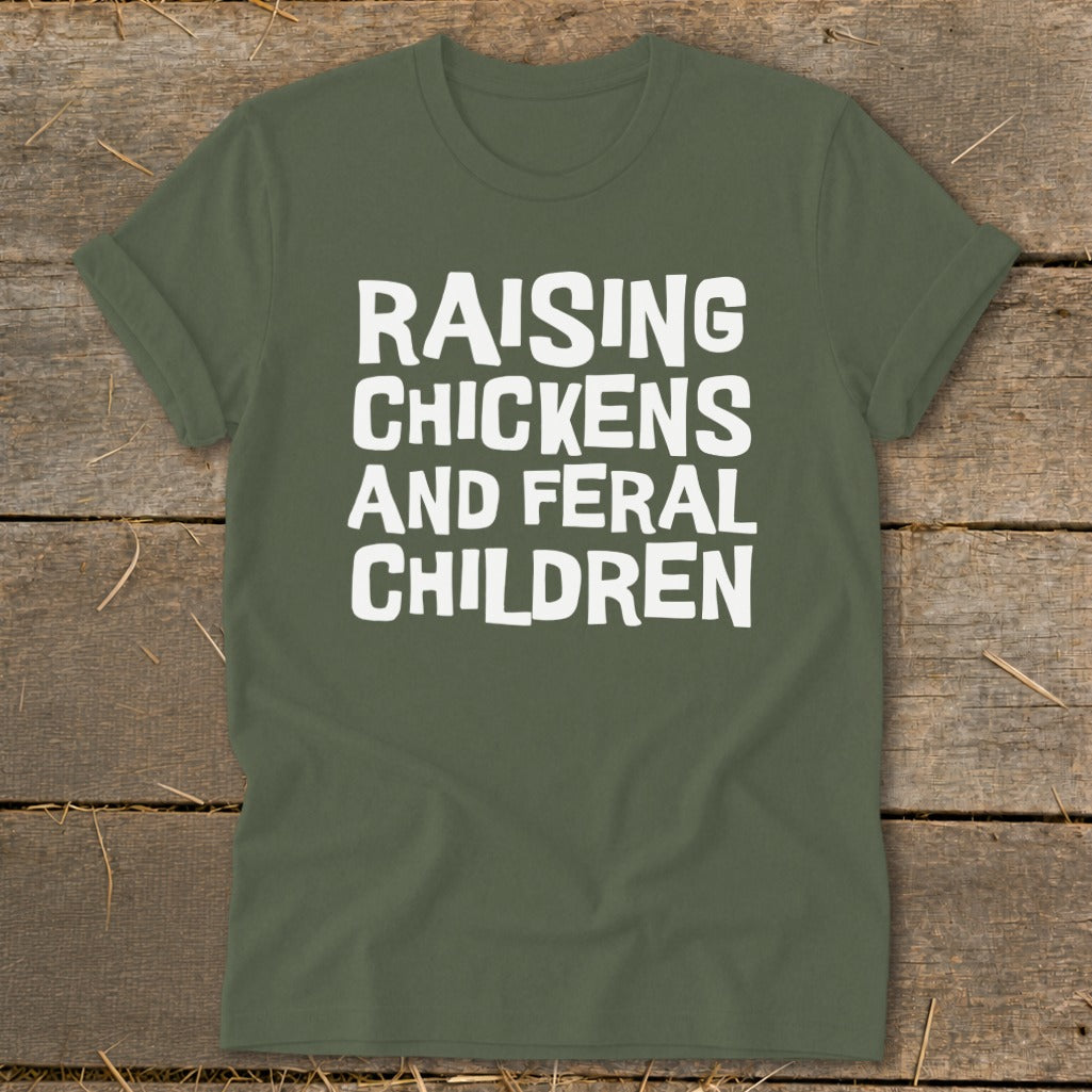 Olive green t-shirt with white text that reads "RAISING CHICKENS AND FERAL CHILDREN".