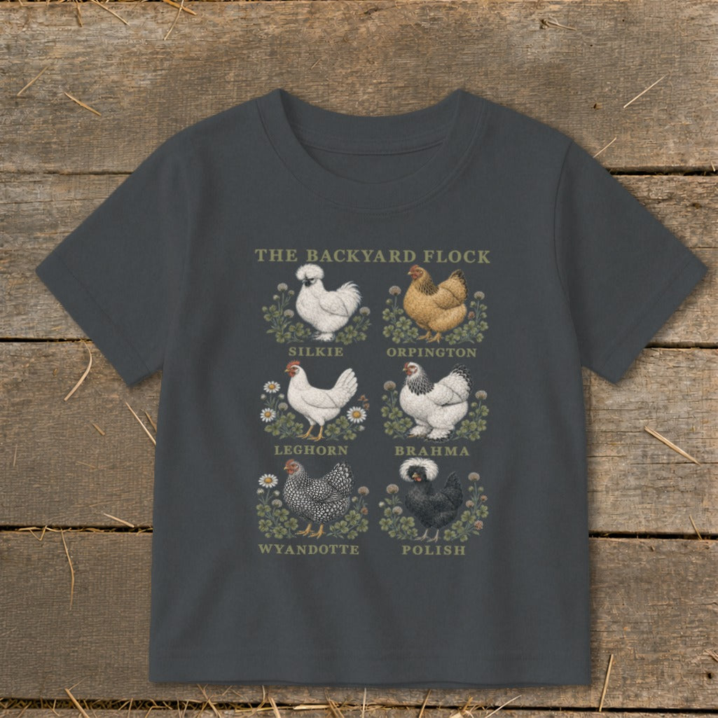 T-shirt graphic with "The Backyard Flock" title and illustrations of six chicken breeds.
