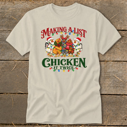 T-shirt with cartoon chickens in Santa hats and festive lights, reads "Making a list, chicken it twice."