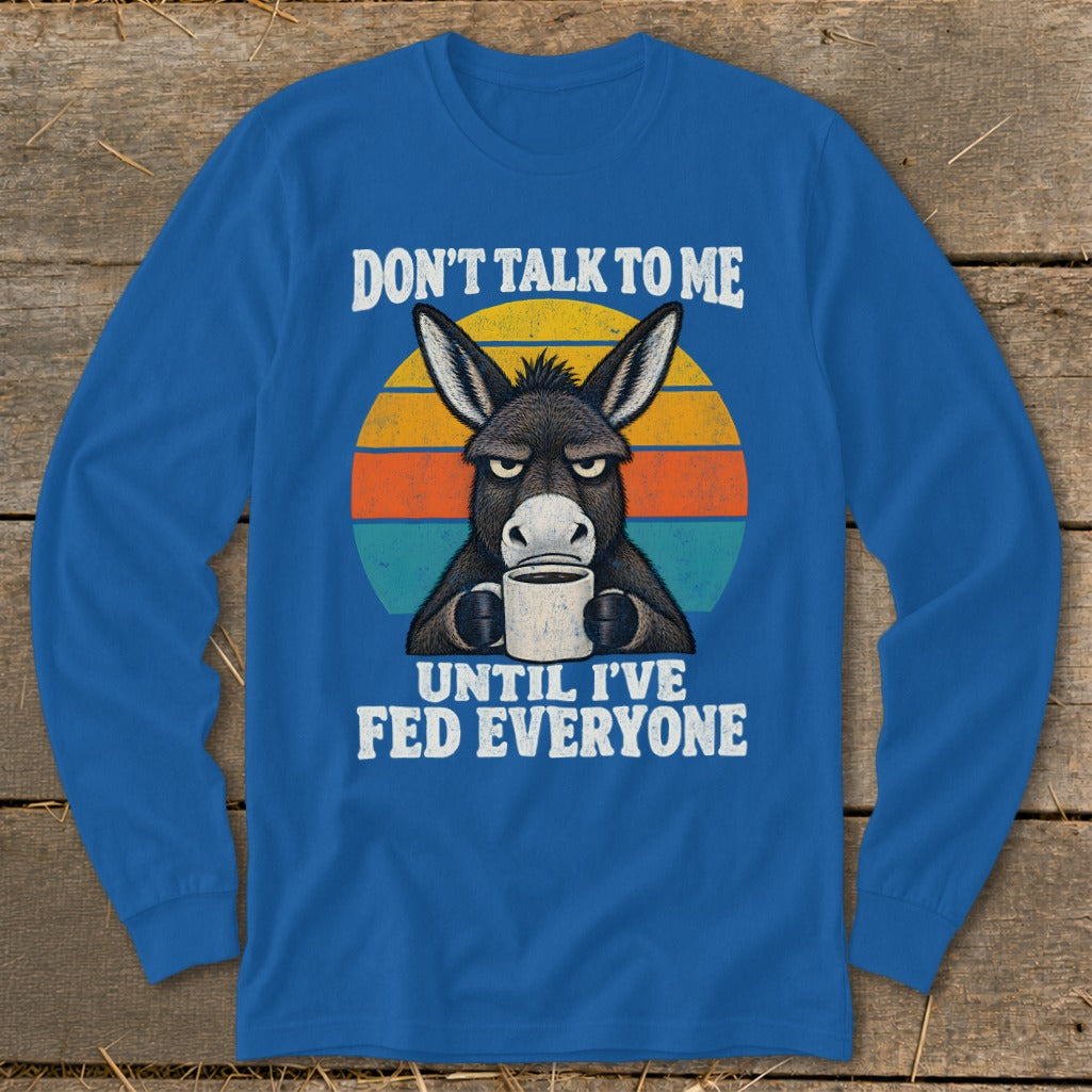 Royal blue long-sleeved shirt with a grumpy donkey graphic holding a mug and retro text.