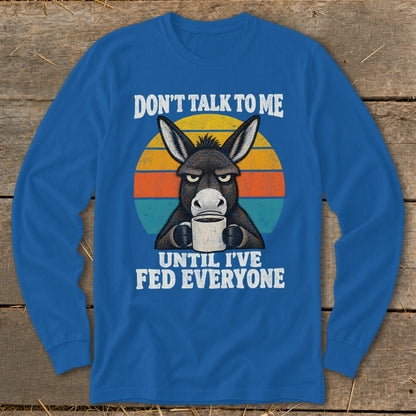 Royal blue long-sleeved shirt with a grumpy donkey graphic holding a mug and retro text.