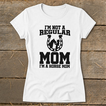 White t-shirt with text "I'M NOT A REGULAR MOM I'M A HORSE MOM" and horseshoe graphic.