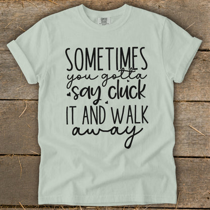 Light green t-shirt with "Sometimes you gotta say cluck it and walk away" text.