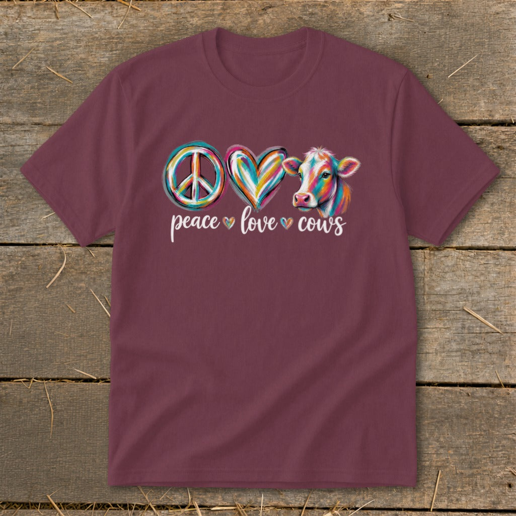 Maroon t-shirt with "peace love cows" text and colorful peace sign, heart, and cow graphic.
