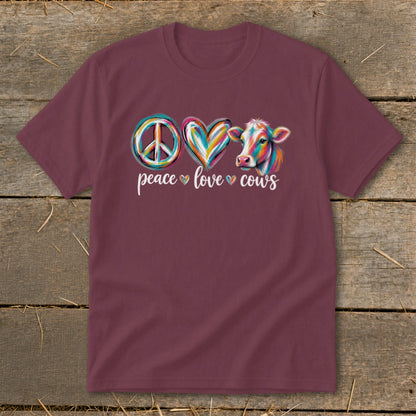 Maroon t-shirt with "peace love cows" text and colorful peace sign, heart, and cow graphic.