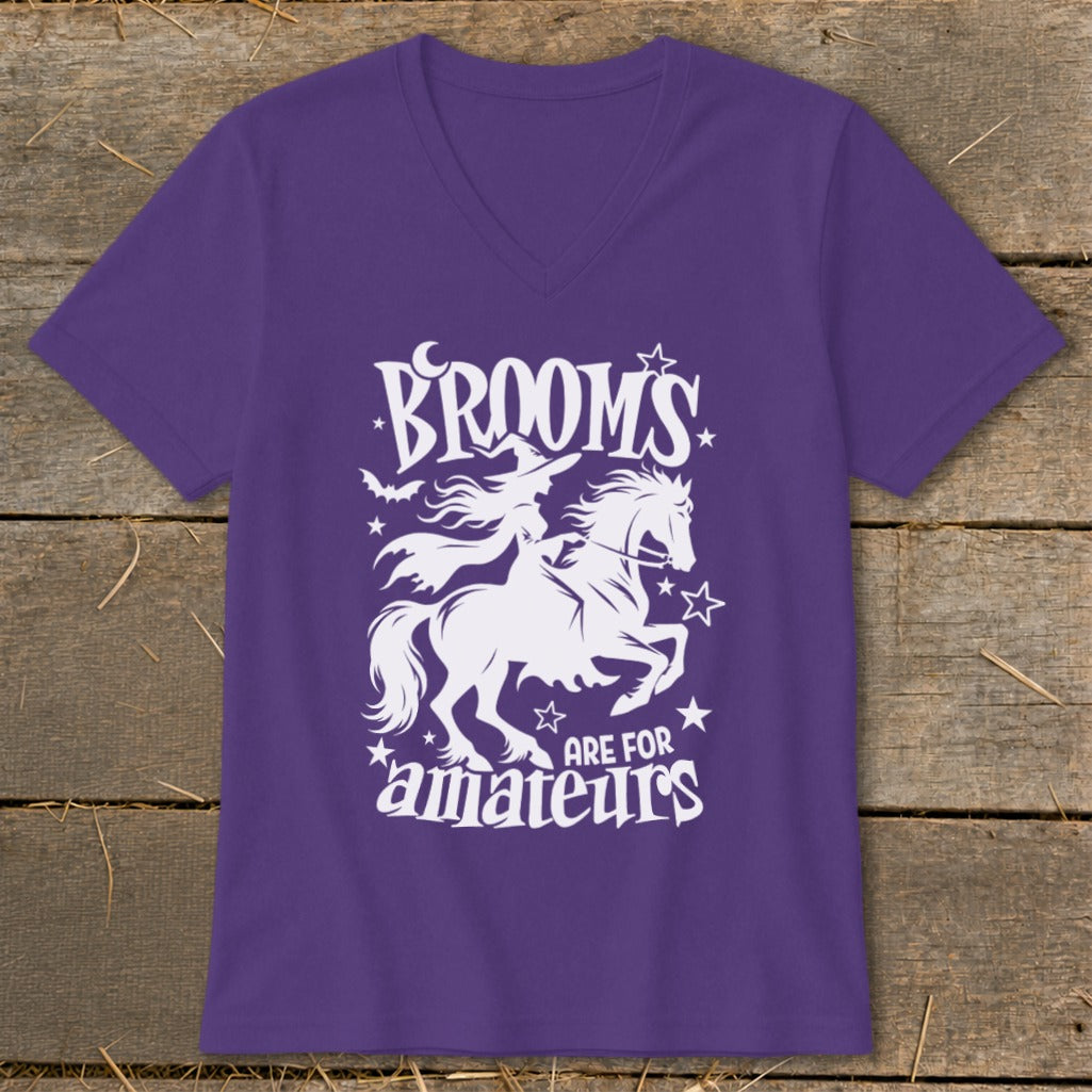 Purple v-neck t-shirt with white graphic of a witch on a horse and text "Broom's are for amateurs".