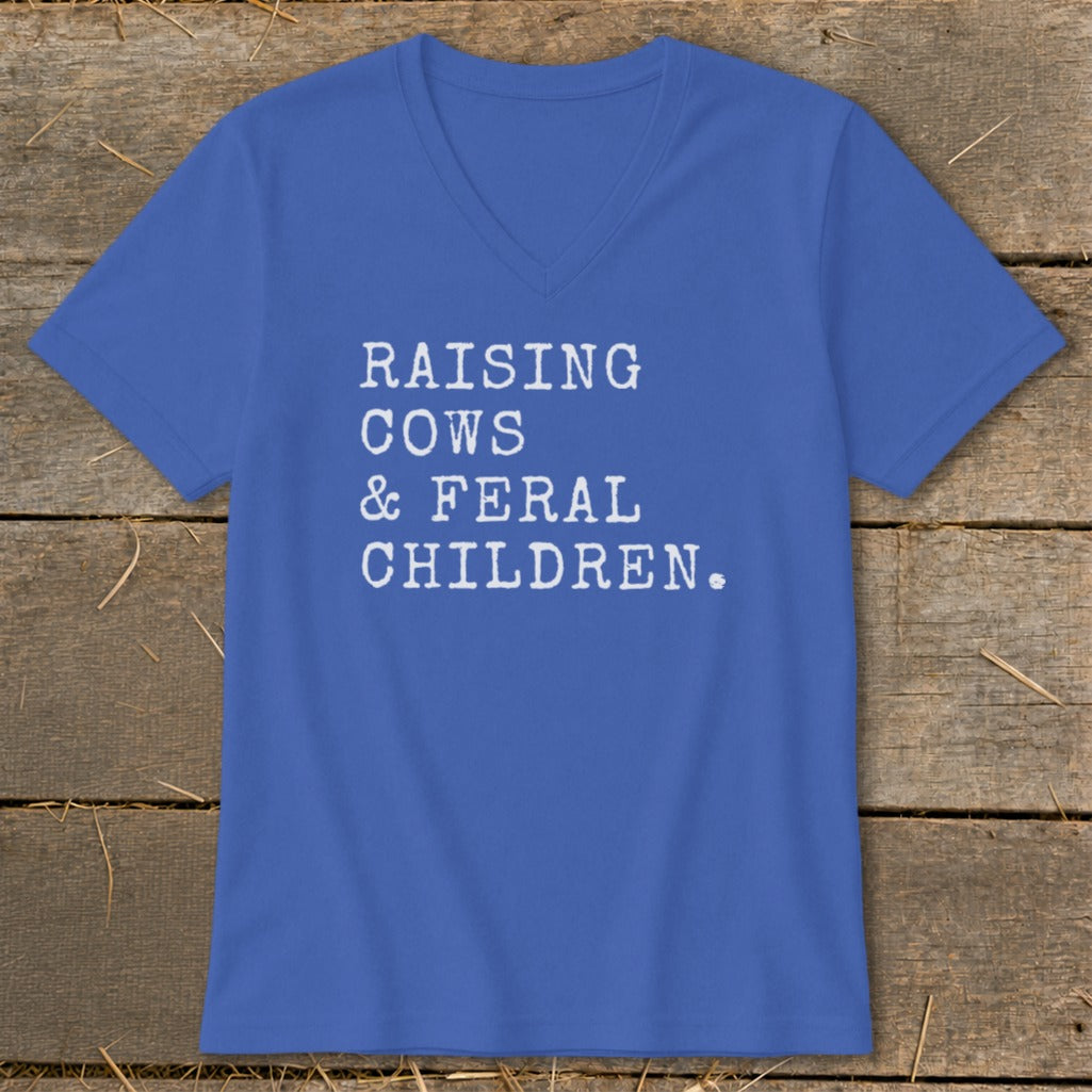 Royal blue v-neck t-shirt with white text "RAISING COWS & FERAL CHILDREN."