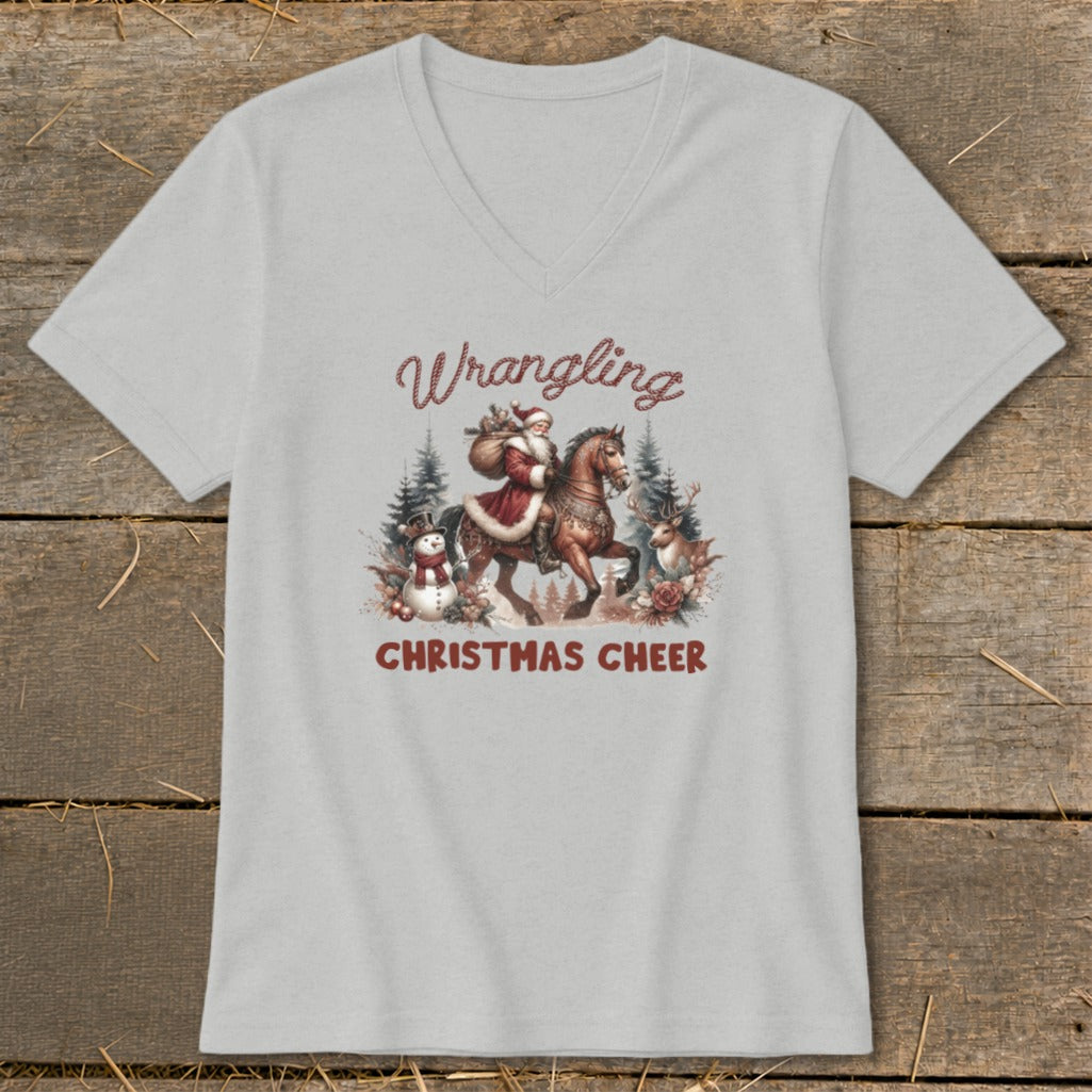 Light grey t-shirt with graphic of Santa riding a horse, snowman, and reindeer.