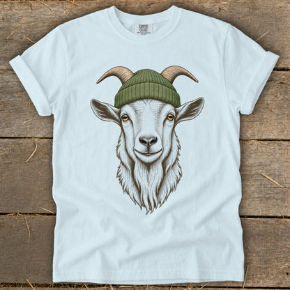 White t-shirt with a detailed illustration of a goat wearing a green knit hat.