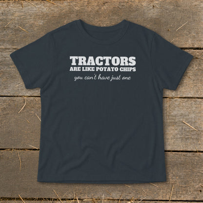 Dark gray t-shirt with white text that reads "TRACTORS ARE LIKE POTATO CHIPS you can't have just one."
