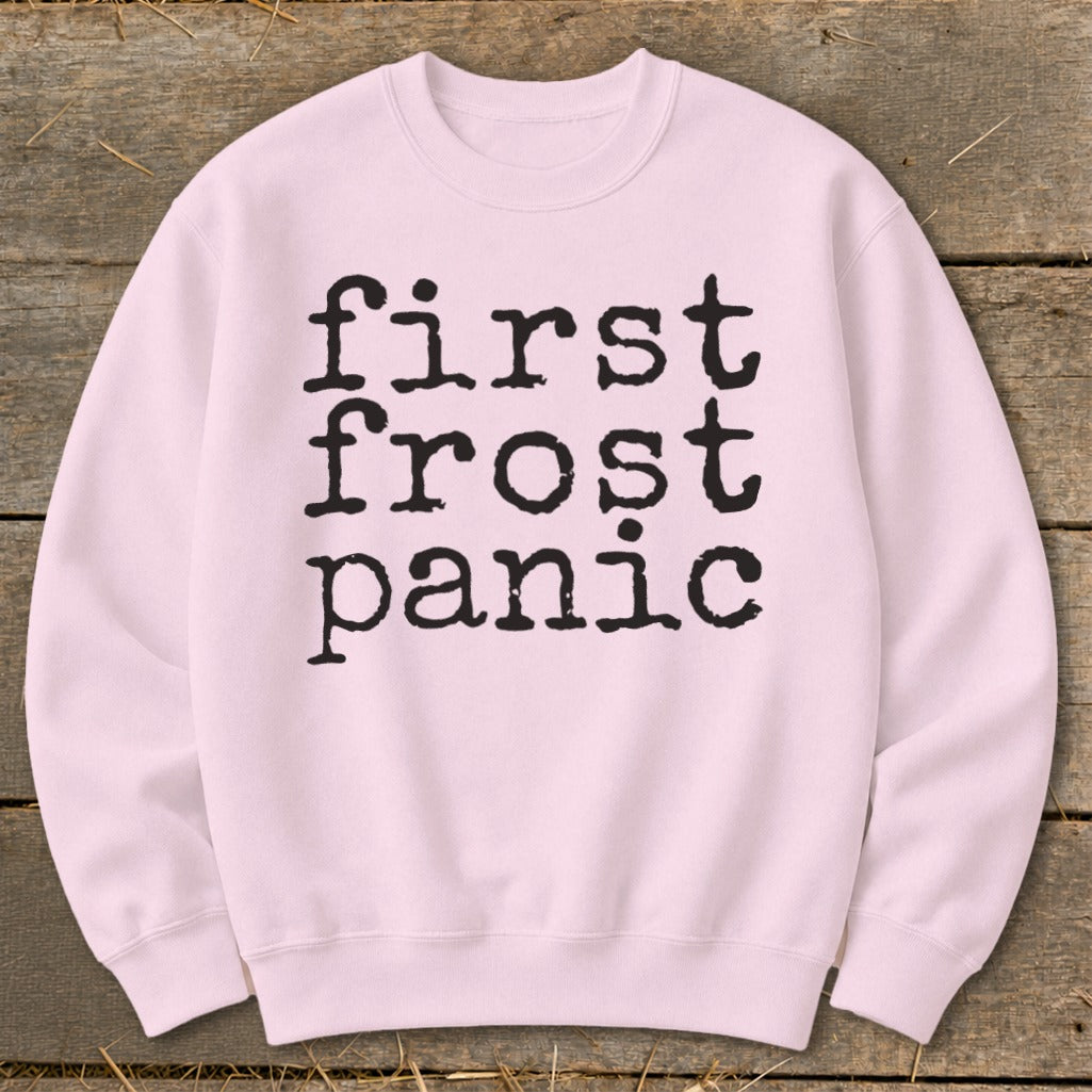 Light pink crewneck sweatshirt with "first frost panic" in black typewriter font.