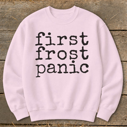 Light pink crewneck sweatshirt with "first frost panic" in black typewriter font.