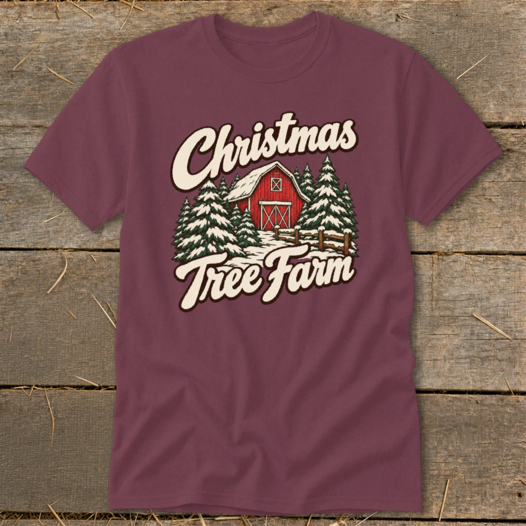 Maroon t-shirt with "Christmas Tree Farm" text over a red barn and snowy evergreen trees.