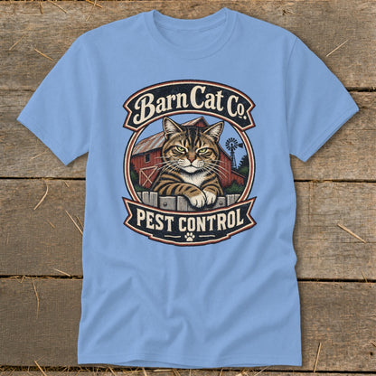 A light blue t-shirt featuring a circular graphic of a tabby cat and a barn with the text "Barn Cat Co. Pest Control".