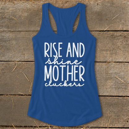 Blue racerback tank top with white text "Rise and Shine Mother Cluckers".