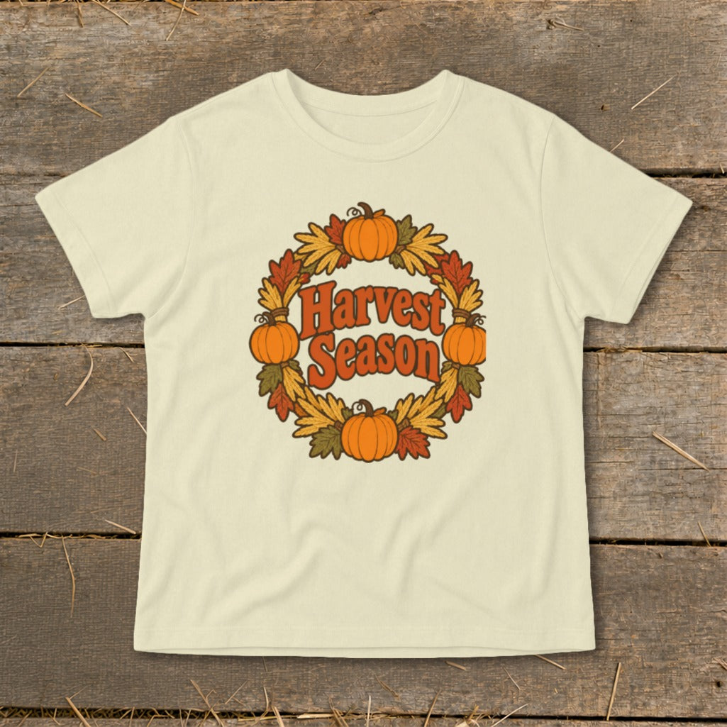 Cream t-shirt with "Harvest Season" text in a floral wreath with pumpkins.