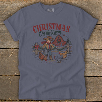 Christmas on the Farm graphic with a boy feeding chickens in front of a barn.