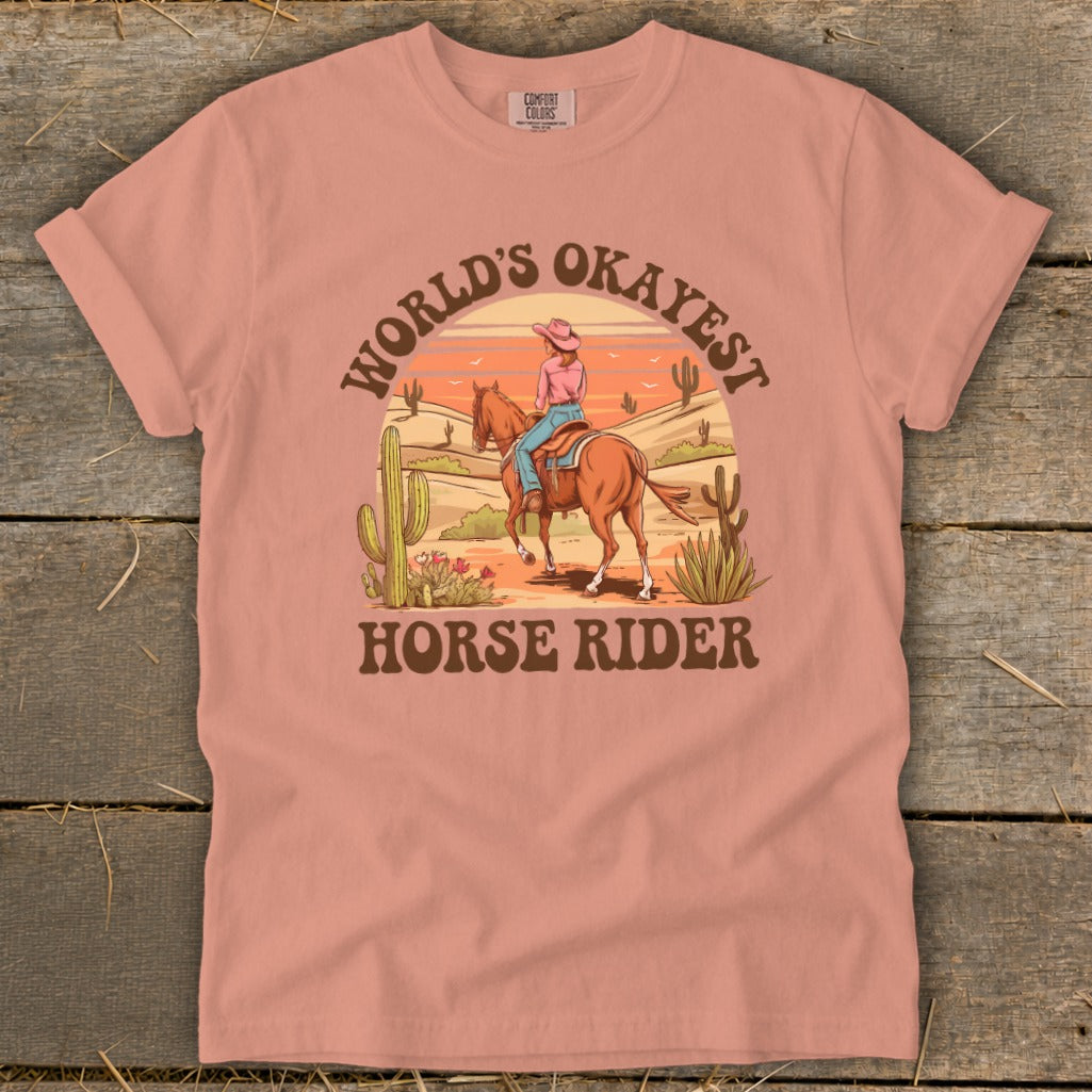 T-shirt with desert scene and text "World's Okayest Horse Rider".