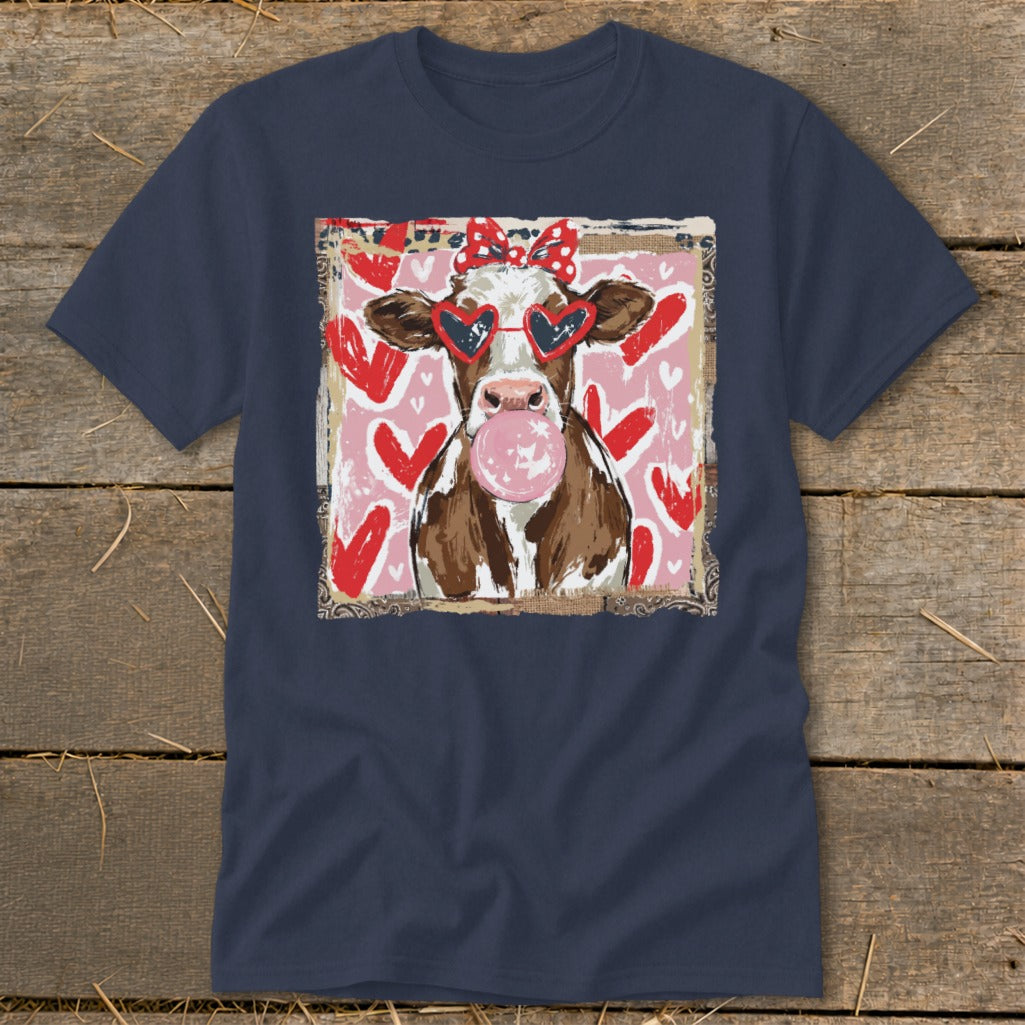 Brown and white cow wearing heart-shaped sunglasses and blowing bubblegum.