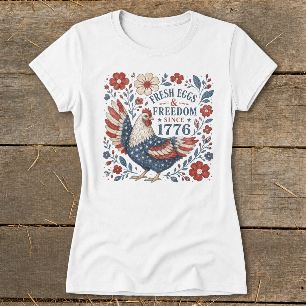 White t-shirt with a chicken design, "Fresh Eggs & Freedom Since 1776".