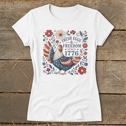 White t-shirt with a chicken design, "Fresh Eggs & Freedom Since 1776".