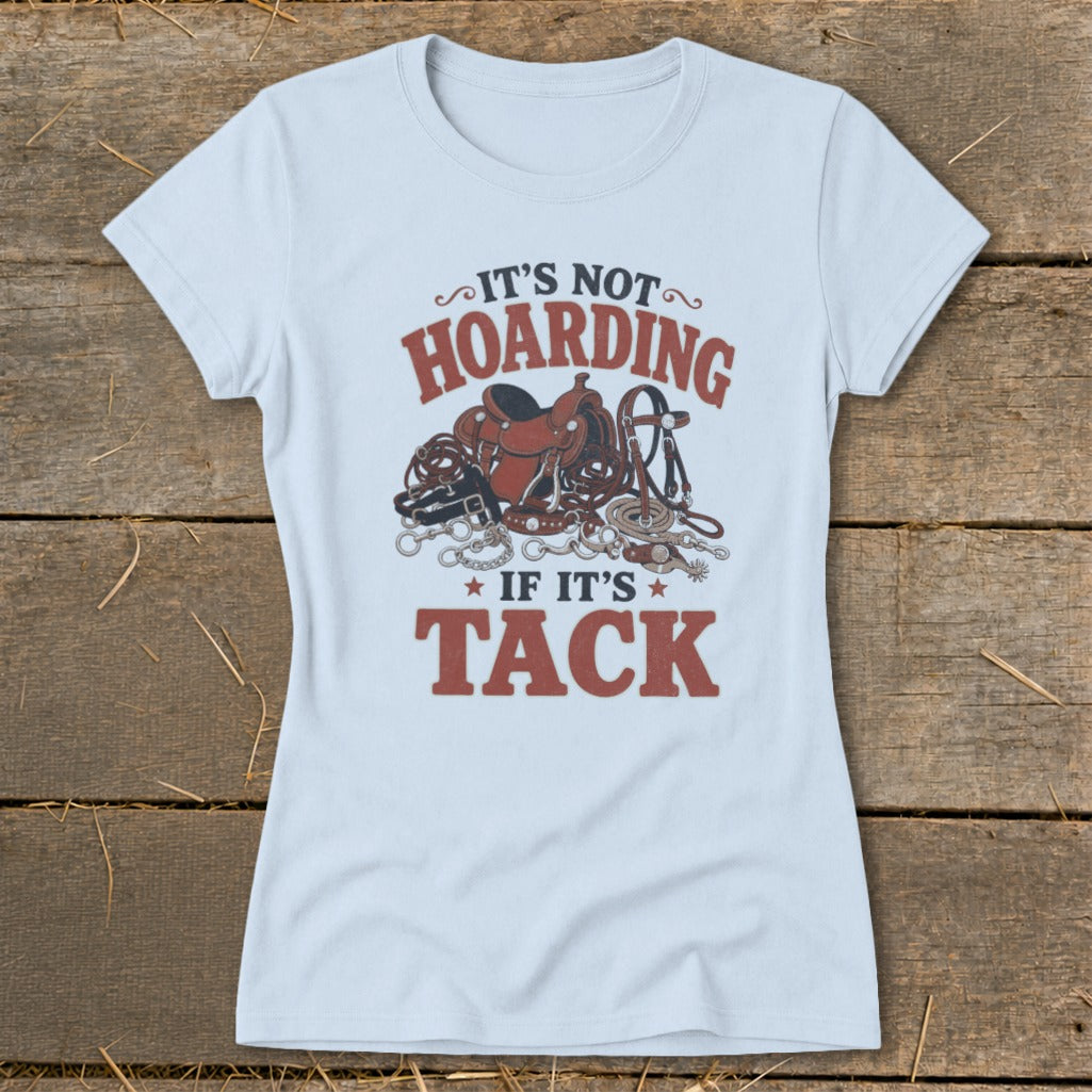 Light blue t-shirt with "It's not hoarding if it's tack" text and horse tack graphic.