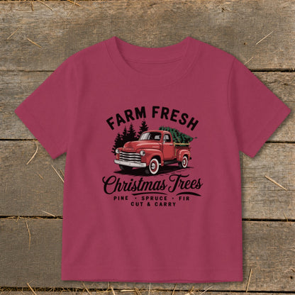 T-shirt with vintage red truck carrying Christmas trees and "Farm Fresh Christmas Trees" text.