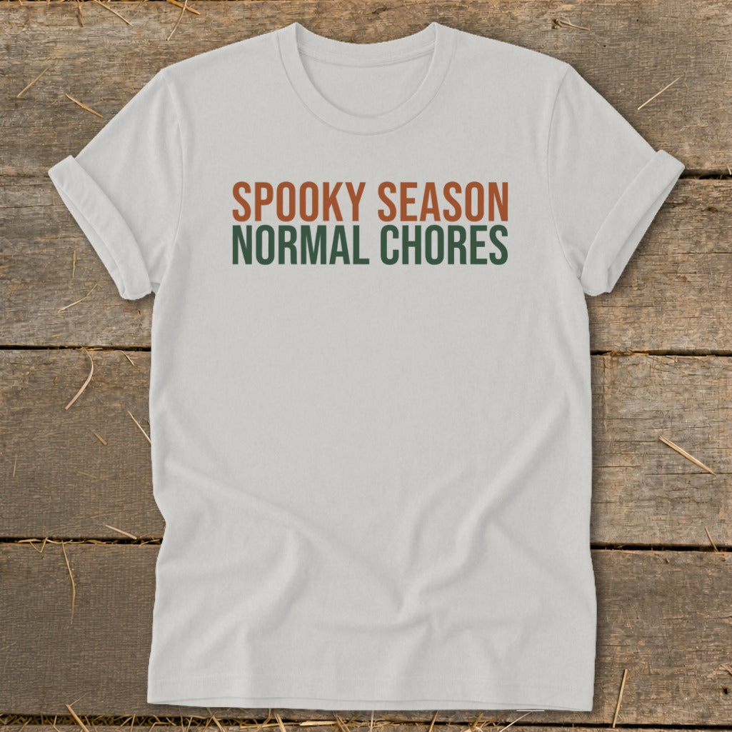 White t-shirt with "SPOOKY SEASON" and "NORMAL CHORES" text.