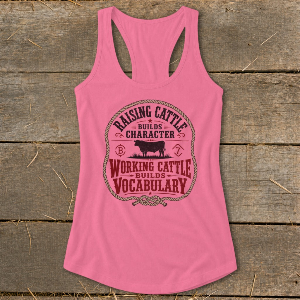 Pink tank top with "Raising cattle builds character" and "Working cattle builds vocabulary".
