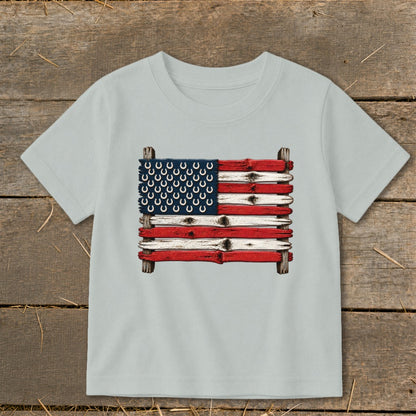 Light grey crewneck t-shirt featuring an American flag graphic made of painted wooden planks with horseshoes.