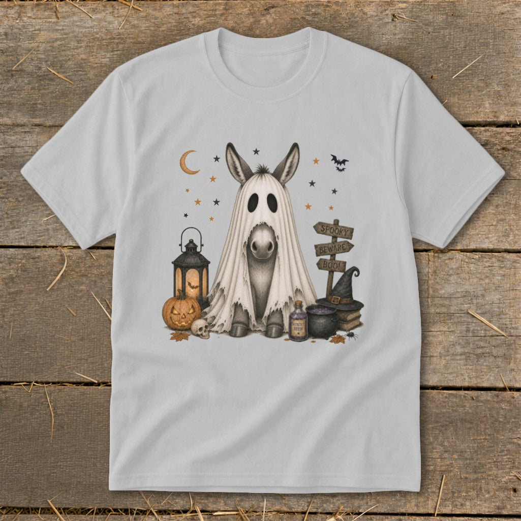 Ghost donkey with Halloween props, including a pumpkin, lantern, and witch hat.