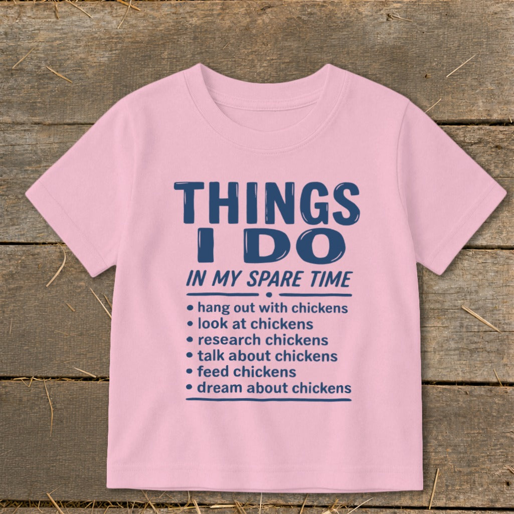 Pink t-shirt with "THINGS I DO IN MY SPARE TIME" and chicken-related list.