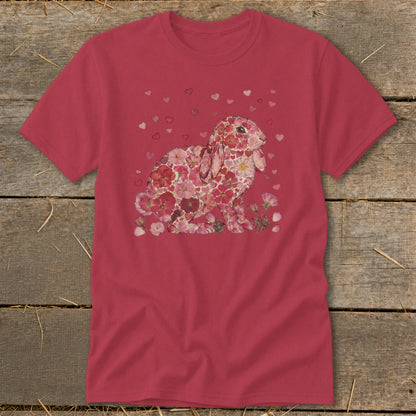 Pink t-shirt with a floral bunny illustration surrounded by small hearts.