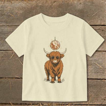 Highland cow wearing sunglasses with a disco ball above.