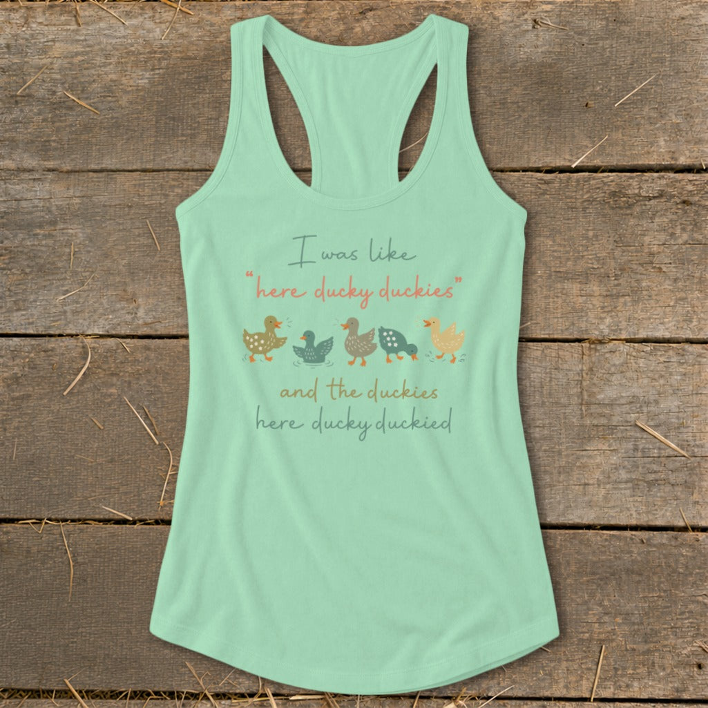 Mint green tank top with cartoon ducks and text "here ducky duckies".