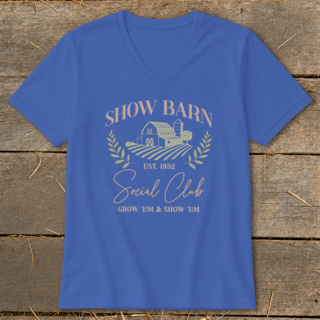 Blue v-neck t-shirt with "Show Barn Social Club" text and barn graphic.