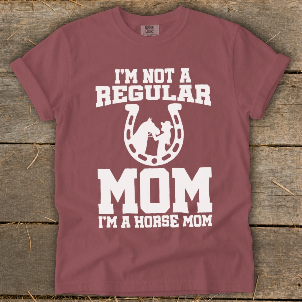 Maroon t-shirt with white text and graphic: "I'M NOT A REGULAR MOM I'M A HORSE MOM."