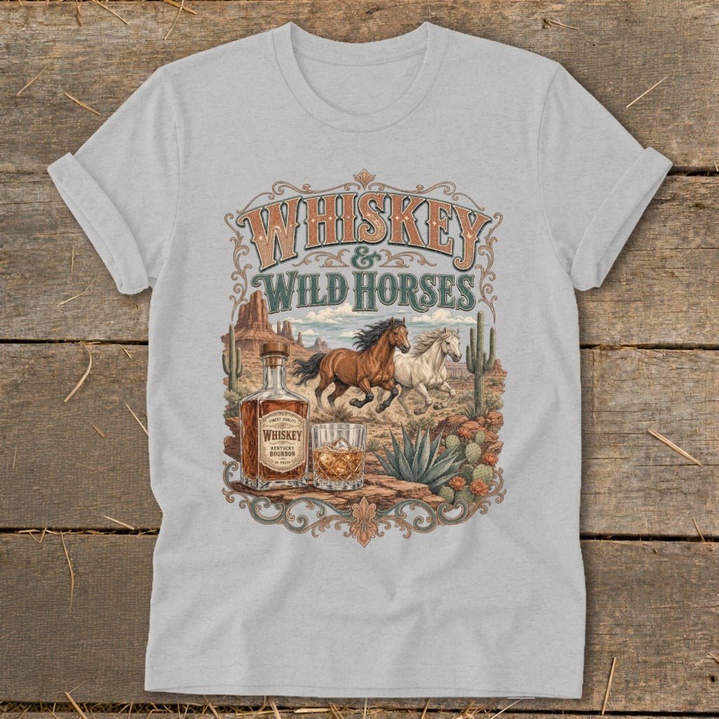 Whiskey & Wild Horses graphic on a light grey t-shirt with desert landscape.
