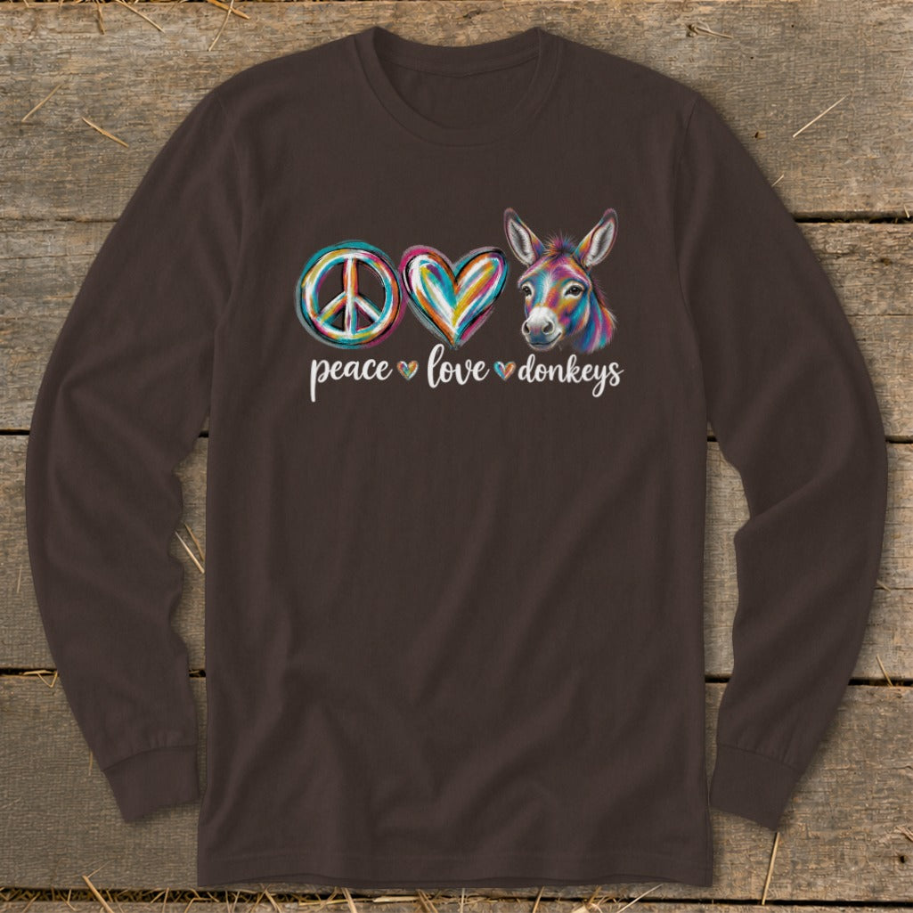 Brown long-sleeve shirt with peace, heart, and colorful donkey graphic and text.