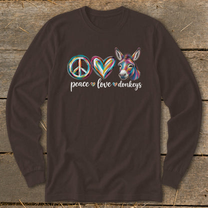 Brown long-sleeve shirt with peace, heart, and colorful donkey graphic and text.