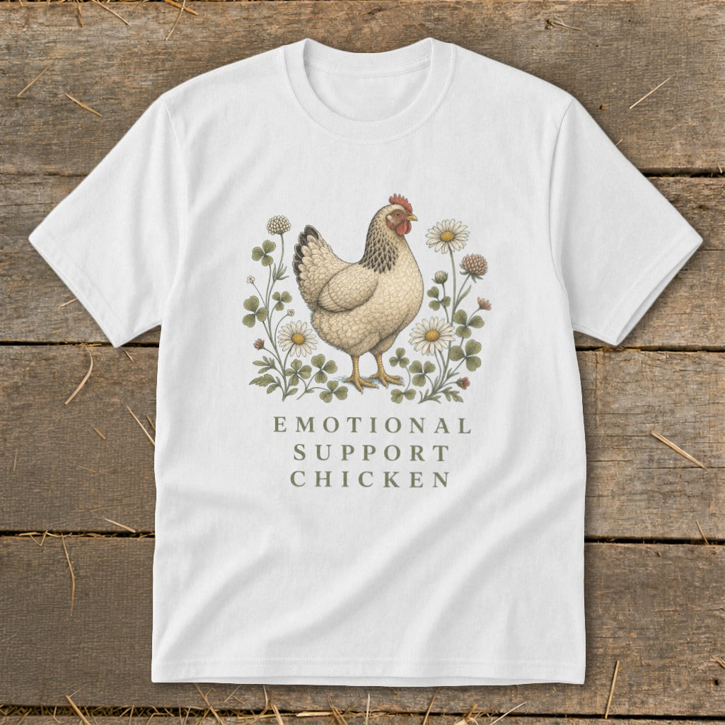White t-shirt with a chicken, flowers, and clover graphic. Text reads "Emotional Support Chicken".