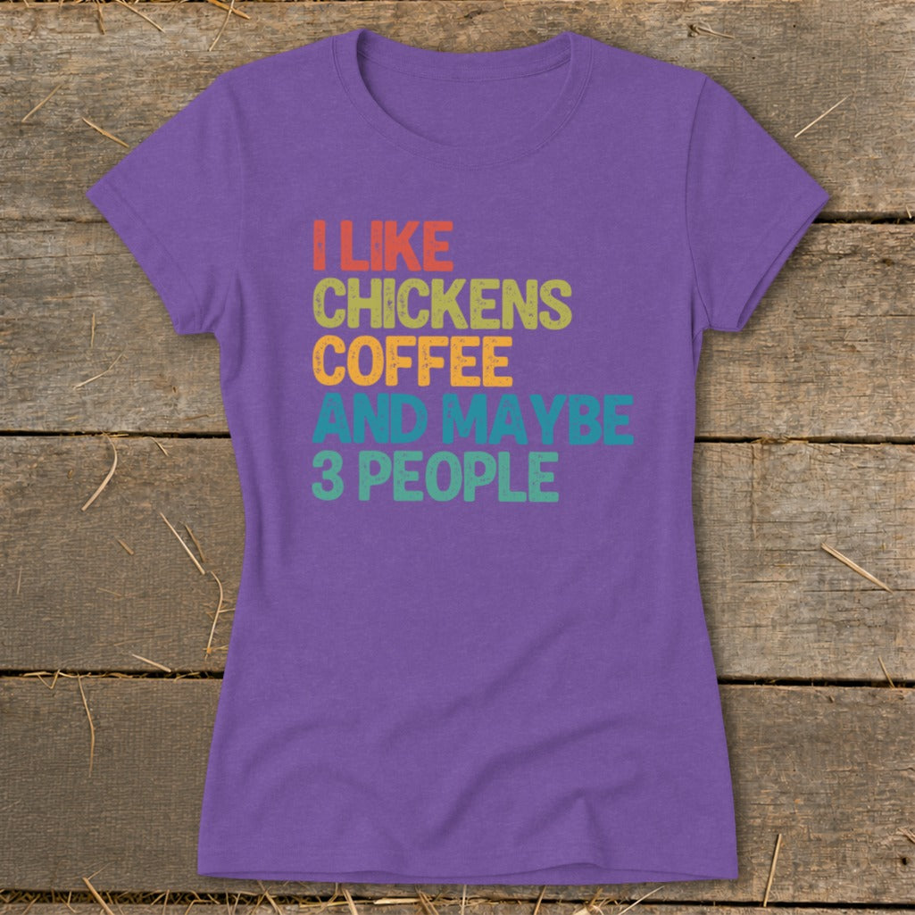 Purple t-shirt with text "I LIKE CHICKENS COFFEE AND MAYBE 3 PEOPLE".